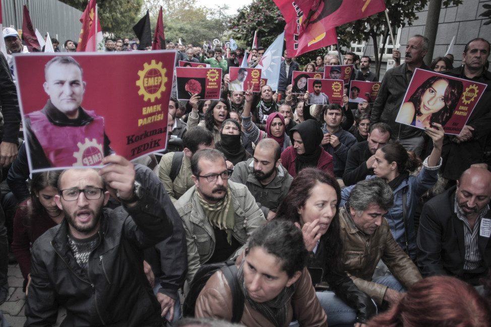 Protesters stage a sit-in after they were prevented by police to march in Istanbul, Turkey on Oct. 13, 2015. (AP)