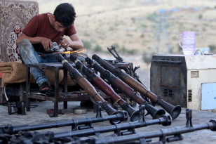 A Kurdish man repairs weapons for Kurdish Peshmerga forces fighting against Islamic State militants, in his shop in northern Iraq on Sept. 15, 2015.  (Reuters)