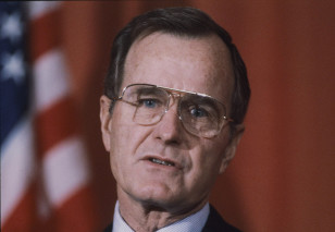 Then Vice President George Bush addresses a news conference at the American Embassy in London on Feb. 10, 1983. (AP/file).