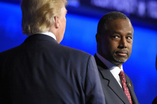 Ben Carson watches as Donald Trump takes the stage during the CNBC Republican presidential debate on Oct. 28, 2015 in Boulder, Colo. (AP)