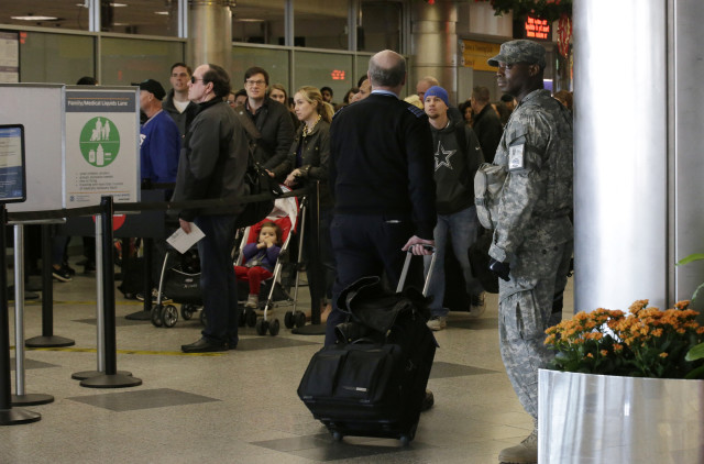 A member of the National Guard stands watch at a security checkpoint at La Guardia Airport in New York November 25, 2015. (Reuters) 