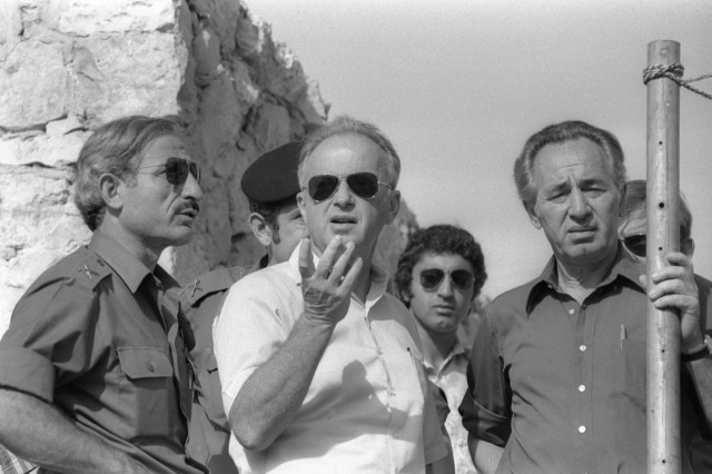 Israel's Defense Minister Shimon Peres (R) stands next to Prime Minister Yitzhak Rabin during a visit to the ruins of a synagogue in the West Bank City of Hebron Oct. 15, 1976 in this photo released by the Israeli government. (Reuters)