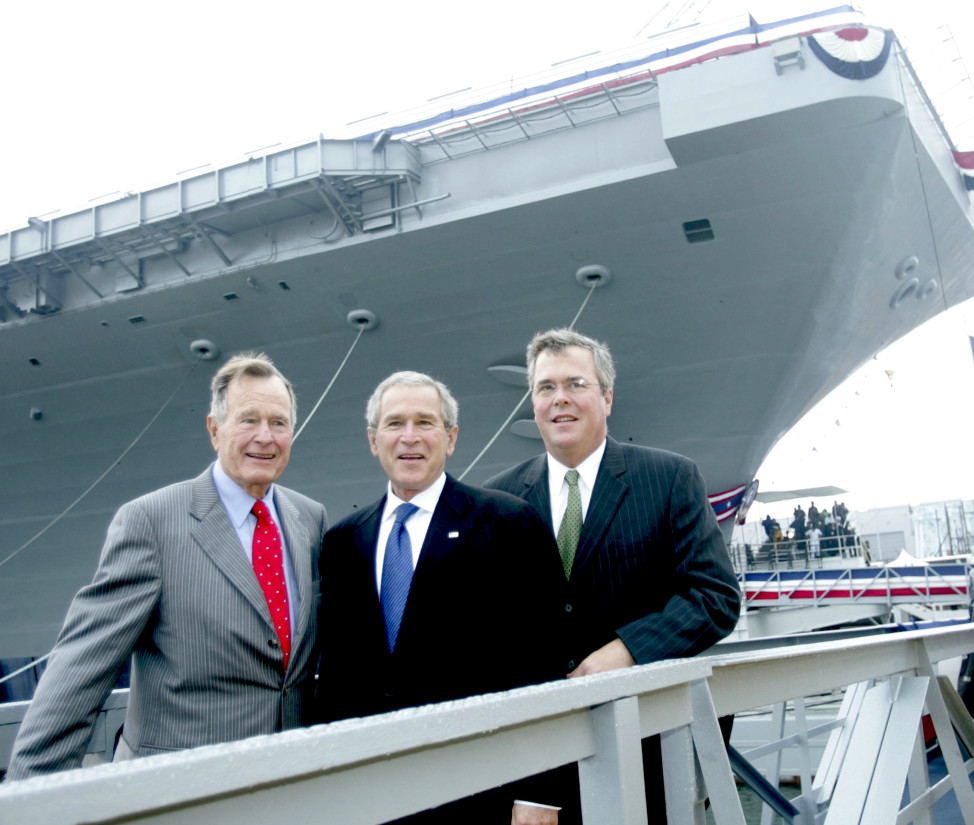 President Bush, center with former President George H.W. Bush and Florida Gov. Jeb  Bush, right, pose in front of the aircraft carrier George H.W. Bush after a christening ceremony in Newport News, Va. on Oct.. 7, 2006. (AP/File)