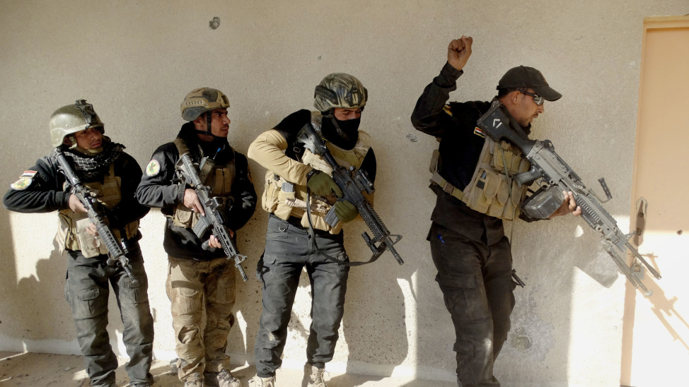 Iraqi security forces search a building in the government complex in central Ramadi, 115 kilometers west of Baghdad, Iraq on December 27, 2015 (AP). 