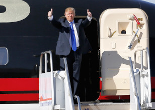 Republican presidential candidate Donald Trump gives as thumbs-up as he arrives for a campaign rally, Dec. 16, 2015, in Mesa, Arizona. (AP)