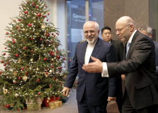Iranian Foreign Minister Mohammad Javad Zarif (L) is greeted as he arrives at the German Mission to the United Nations in New York, December 17, 2015. Zarif participated in Syrian peace talks at the U.N. (REUTERS)