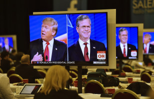 Republican presidential candidates Donald Trump (L) and  former Governor Jeb Bush (R) are seen debating on video monitors during the Republican presidential debate in Las Vegas on Dec. 15, 2015. (Reuters)