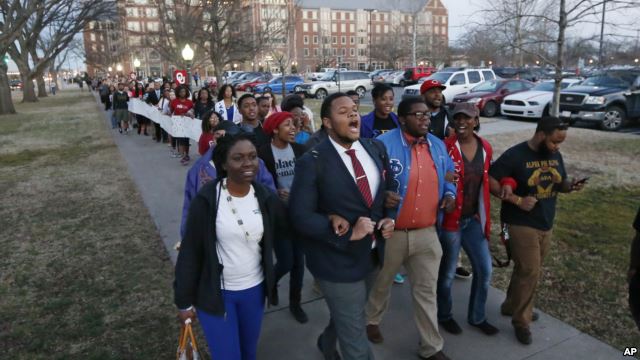 University of Oklahoma students march to the now closed University of Oklahoma's Sigma Alpha Epsilon fraternity house during a rally in Norman, Okla., March 10, 2015. A member of the fraternity was seen on a viral video chanting racial slurs 