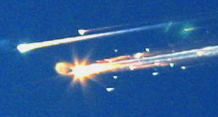 Debris from the space shuttle Columbia streaks across the sky over Tyler, Texas on Feb. 1, 2003. (AP file photo)