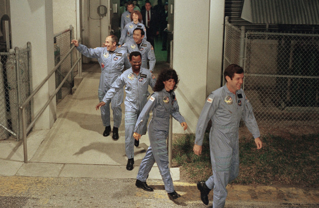 The crew for the Space Shuttle Challenger flight 51-L leaves their quarters for the launch pad, Jan. 27, 1986 at the Kennedy Space Center in Florida. (AP)