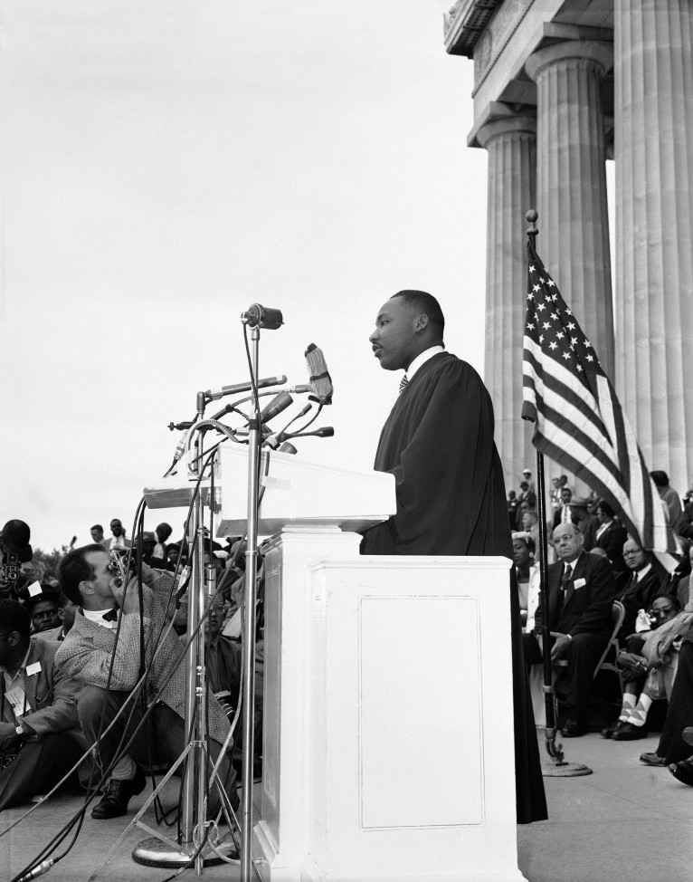 The Rev. Martin Luther King Jr., of Montgomery, Alabama speaks at a mass demonstration before the Lincoln Memorial in Washington as civil rights leaders called on the government to put more teeth in the Supreme Court's desegregation decisions, May 17, 1957. King said both Democrats and Republicans have betrayed the cause of justice on civil rights questions. (AP Photo/Charles Gorry)