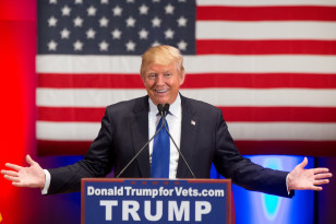 Republican presidential candidate Donald Trump smiles while speaking at a rally in Des Moines, Iowa on Jan. 28, 2016. (AP) 