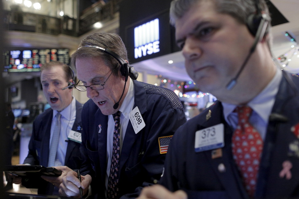 Traders work on the floor of the New York Stock Exchange