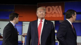 Republican presidential candidate, businessman Donald Trump stands on the stage before the Fox Business Network Republican presidential debate at the North Charleston Coliseum, Thursday, Jan. 14, 2016.