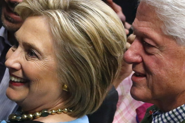 Democratic presidential candidate Hillary Clinton and former President Bill Clinton are seen during a campaign stop in Manchester, NH  Feb. 8, 2016. (Reuters)