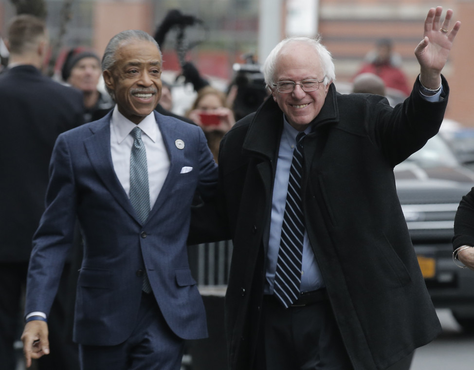 Democratic presidential candidate Bernie Sanders (R) is greeted by the Rev. Al Sharpton in the Harlem section of New York a day after winning the New Hampshire primary. (Reuters)