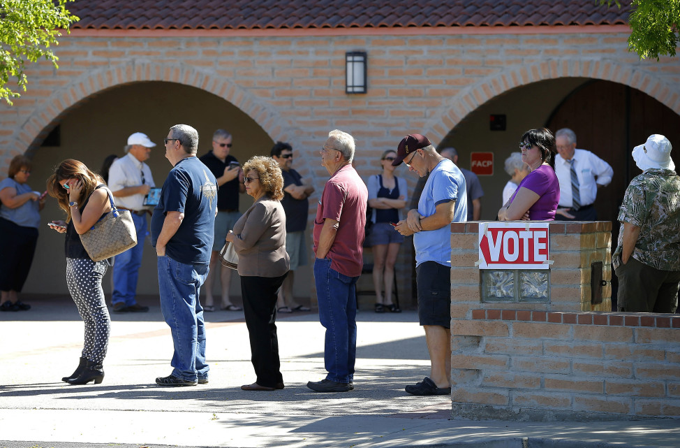 Voters wait in a long line to cast their ballot in Arizona's presidential primary on March 22, 2016 in Gilbert, Ariz. (AP)