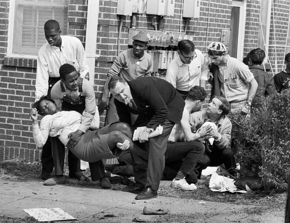 Amelia Boynton is carried and another injured man tended to after they were injured when state police broke up a demonstration march in Selma, Ala. Boynton, wife of a real estate and insurance man, has been a leader in civil rights efforts. The day, which became known as "Bloody Sunday," is widely credited for galvanizing the nation's leaders and ultimately yielded passage of the Voting Rights Act of 1965. (AP)