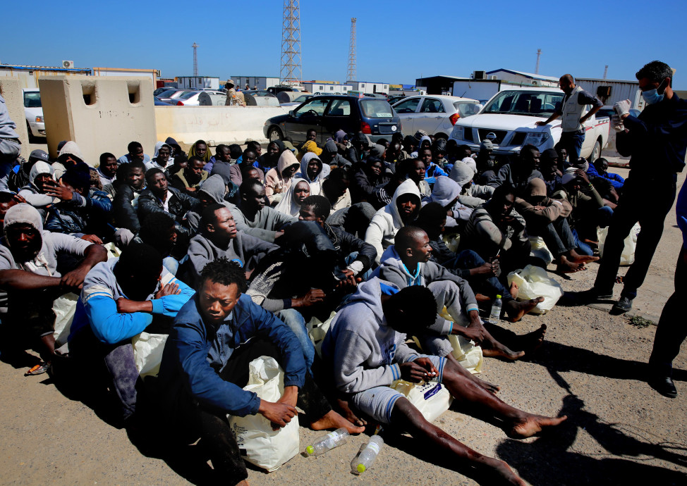 Illegal African migrants wait to receive medical assistance after being rescued in a port in Tripoli on April 11, 2016. (AP)