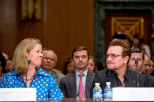 UN High Commissioner for Refugees Deputy High Commissioner Kelly Clements, left, and Irish rock star and activist Bono, right, arrive to testify at the senate on Capitol Hill on April 12, 2016. (AP)