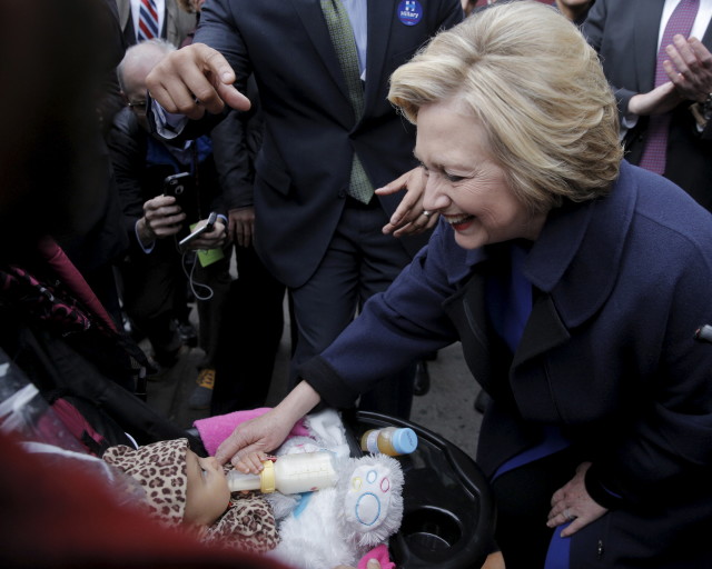 Democratic presidential candidate Hillary Clinton is greeted by a supporter with a baby during a campaign stop in the Bronx on April 7, 2016. (Reuters)