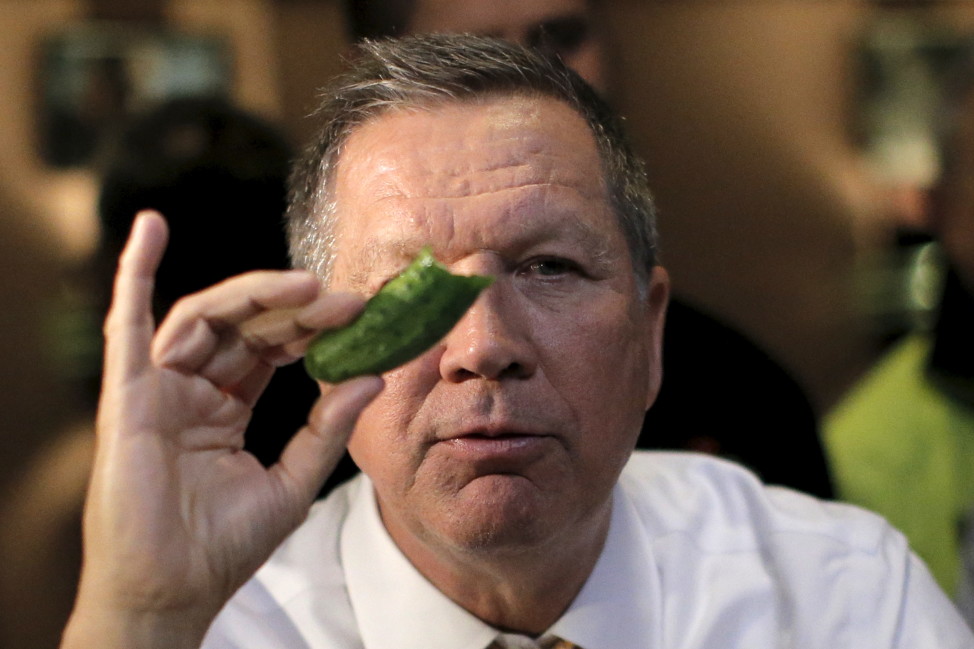 Republican presidential candidate John Kasich eats a pickle at PJ Bernstein's Deli Restaurant in New York City on April 16, 2016. (Reuters)
