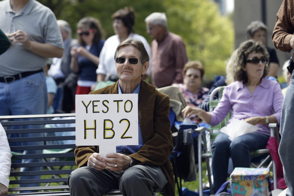 Supporters of House Bill 2 gather at the North Carolina State Capitol in Raleigh, N.C., Monday, April 11, 2016, during a rally in support of a law that blocks rules allowing transgender people to use the bathroom aligned with their gender identity. (AP)