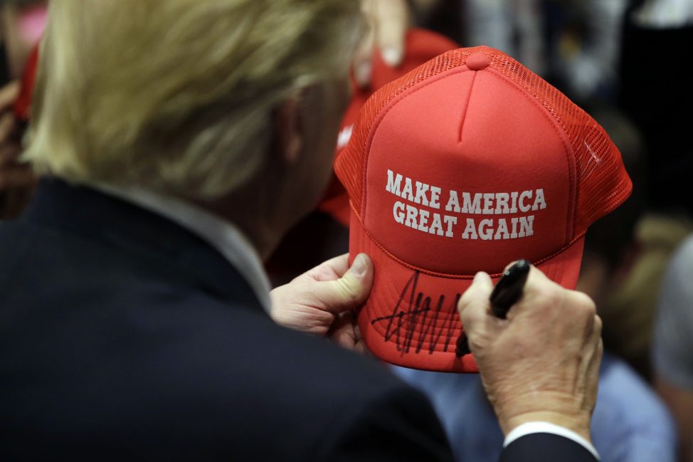 Republican presidential candidate Donald Trump signs an autograph for a supporter after speaking at a campaign rally at West Chester University, Monday, April 25, 2016, in West Chester, Pa. (AP)