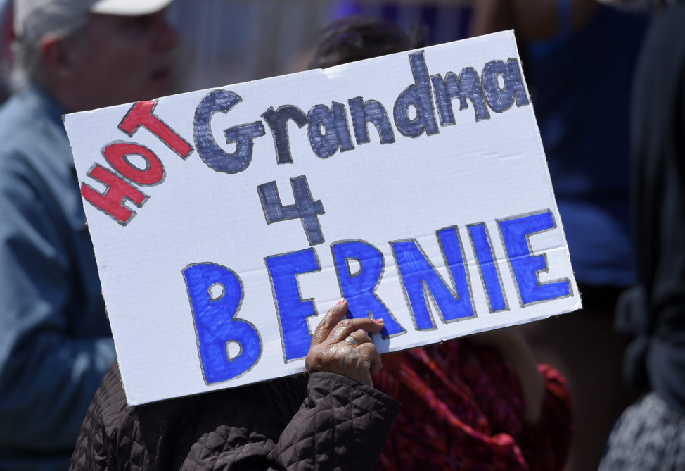 A supporter holds up a sign for Democratic presidential candidate Sen. Bernie Sanders, I-Vt., speaks at a campaign rally, Saturday, May 28, 2016, in Santa Maria, Calif. (AP)