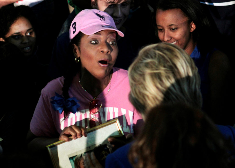 A campaign supporter reacts to meeting U.S. Democratic presidential candidate Hillary Clinton during a campaign rally in the Hall of Fame Pavilion at Louisville Slugger Field in Louisville, Kentucky, U.S., May 10, 2016. REUTERS/John Sommers II    - RTX2DQCU