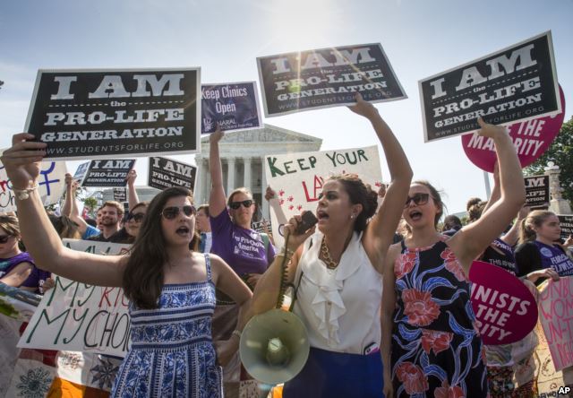 Reagan Barklage of St. Louis, center, and other anti-abortion activists demonstrate in front of the Supreme Court in Washington, Monday, June 27, 2016, as the justices struck down the strict Texas anti-abortion restriction law known as HB2. (AP) 