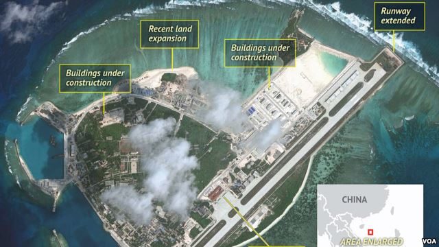 FILE - Satellite imagery analysis by geopolitical intelligence firm Stratfor shows overall land, building and military expansion by China on Woody Island in the South China Sea. (Courtesy of Stratfor)