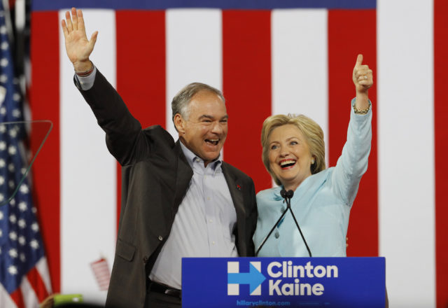 Democratic U.S. vice presidential candidate Senator Tim Kaine (D-VA) waves with his presidential running-mate Hillary Clinton after she introduced him during a campaign rally in Miami, Florida, U.S. July 23, 2016. (Reuters) 