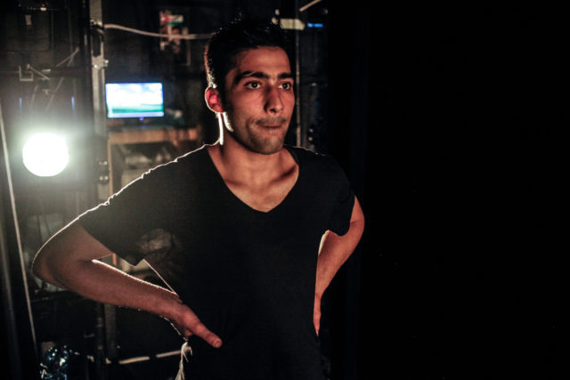In this April 16, 2015 file photo, Adil Faraj waits backstage for the cue to begin his final rehearsal before his on-stage debut at the Amman Contemporary Dance Festival in Amman, Jordan. Faraj was buying clothes in the neighborhood of Karada for the Islamic holiday of Eid al-Fitr that marks the end of the holy month of Ramadan when a suicide truck bomb exploded, killing him and more than 175 others. 