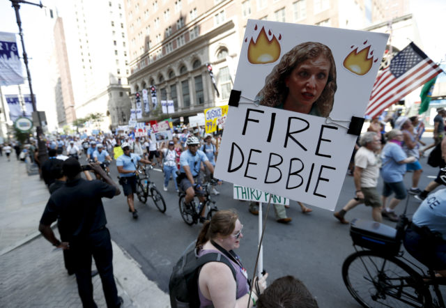 A supporters of Sen. Bernie Sanders, I-Vt., holds up a sign call calling for Debbie Wasserman Schultz, chairwoman of the Democratic National Committee to be fired, Sunday, July 24, 2016, in Philadelphia. The Democratic National Convention starts Monday. (AP) 