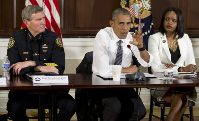 President Barack Obama, joined by Brittany Packnett, of the President's Taskforce on 21st Century Policing, right, and Terry Cunningham, President of the International Association of Chiefs of Police, left, speaks to media at toward the end of a White House meeting about community policing and criminal justice with a group made of activists, civil rights, faith, law enforcement and elected leaders. July 13, 2016 (AP)