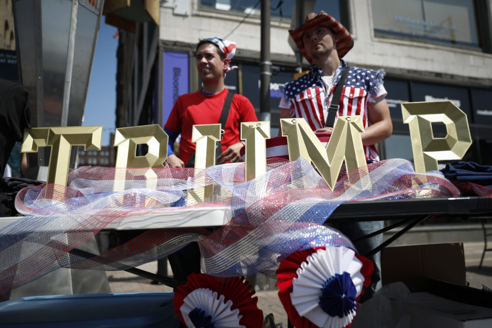 Vendors sell Trump branded items outside the Republican National Convention on Tuesday, July 19, 2016, in Cleveland, during the second day of the Republican convention. (AP Photo/John Minchillo)