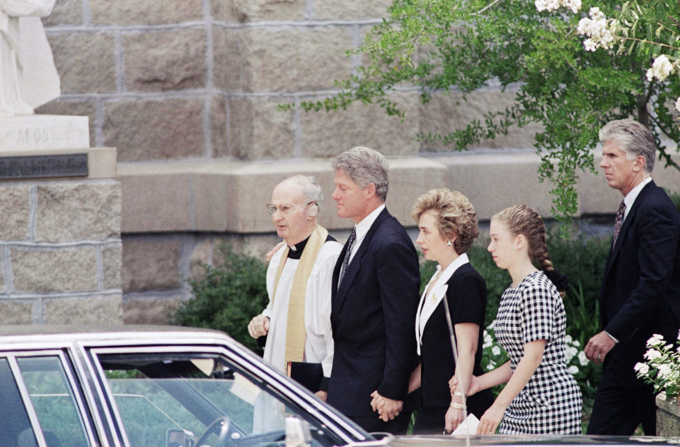 President Bill Clinton, wife Hillary Rodham Clinton, and daughter Chelsea, leave St. Andrew's Catholic Cathedral in Little Rock, Arkansas in this 1993 file photo after funeral services for Deputy White House Counsel Vincent Foster Jr. (AP)