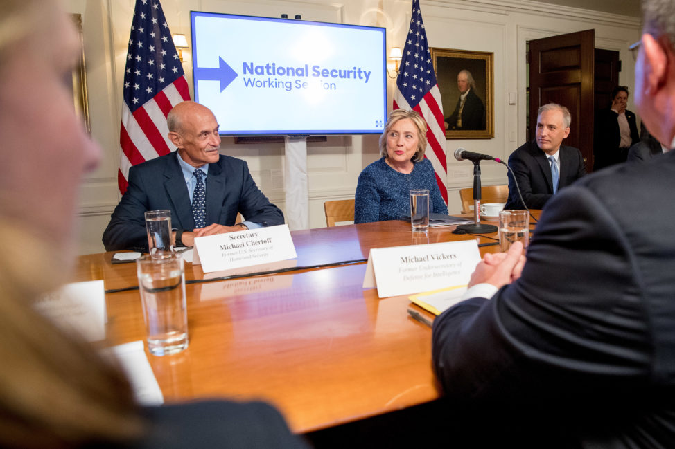 Democratic presidential candidate Hillary Clinton, center, accompanied by former National Counterterrorism Center Director Matt Olson, right, and former Homeland Security Secretary Michael Chertoff, left, attends a National Security working session at the Historical Society Library in New York, Sept. 9, 2016. (AP)