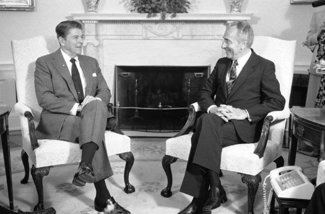 U.S. President Ronald Reagan talks with Prime Minister of Israel Shimon Peres, right, during a meeting at the White House, Tuesday, Oct. 9, 1984. Peres was in Washington for a round of meetings with top administration officials seeking more U.S. aid for Israel's inflation-ravaged economy. (AP)