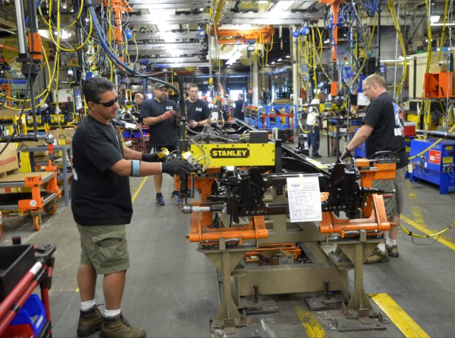 Ford Motor Company’s F-650/F-750 medium-duty trucks roll off the line for the first time at the Ohio Assembly Plant Aug. 12, in Avon Lake, Ohio. Production of the trucks, previously built in Mexico, helps secure more than 1,000 hourly UAW jobs and a $168 million plant investment in the United States. (AP)