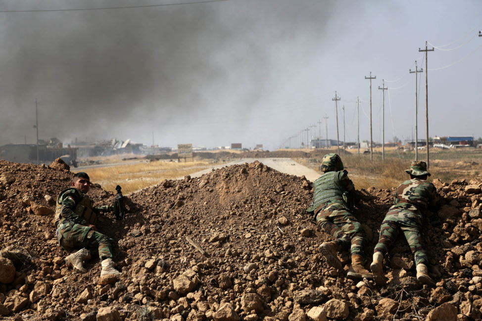 Kurdish security forces take up a position as they fight overlooking the Islamic State-controlled in villages surrounding Mosul, in Khazer, about 30 kilometers (19 miles) east of Mosul, Iraq, Oct. 17, 2016. Iraqi government and Kurdish forces, backed by U.S.-led coalition air and ground support, launched coordinated military operations early on Monday as the long-awaited fight to wrest the northern city of Mosul from Islamic State fighters got underway. (AP) 