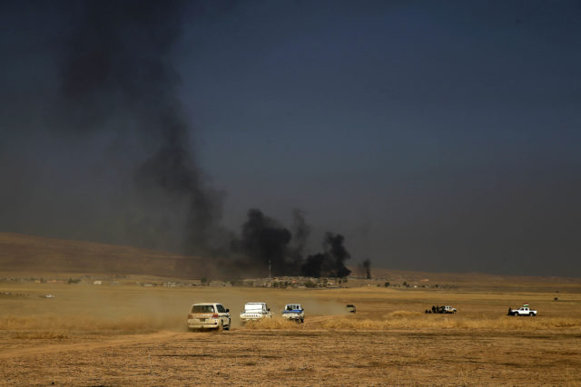 A peshmerga convoy drives towards a frontline in Khazer, about 30 kilometers (19 miles) east of Mosul, Iraq, Oct. 17, 2016. The Iraqi military and the country's Kurdish forces say they launched operations to the south and east of militant-held Mosul early Monday morning. (AP) 