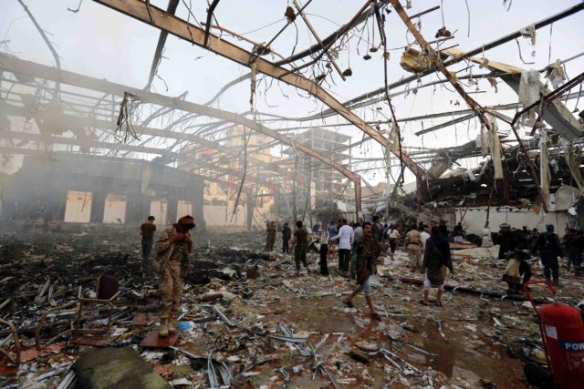 People inspect the aftermath of a Saudi-led coalition airstrike in Sanaa, Yemen, Saturday, Oct. 8, 2016. Yemeni Health Ministry and medical groups say at least 100 people were killed in a Saudi-led coalition airstrike that targeted a funeral hall in the capital, Sanaa.  (AP)  