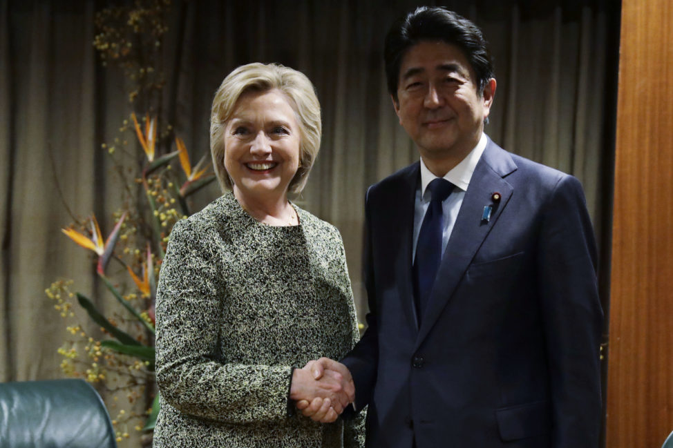 Democratic presidential candidate Hillary Clinton poses for photographs with Japanese Prime Minister Shinzo Abe in New York, Sept. 19, 2016. Clinton requested the meeting, which happened on the sidelines of the U.N. General Assembly. Japanese officials said at the time that Trump did not request a meeting with Abe. (AP) 