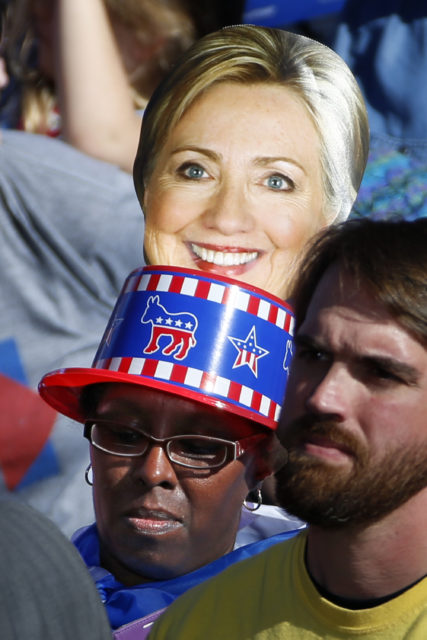 A supporter of Democratic presidential candidate Hillary Clinton listens as she speaks at a rally in front of the Cathedral of Learning on the University of Pittsburgh campus in Pittsburgh, Nov. 7, 2016. (AP)