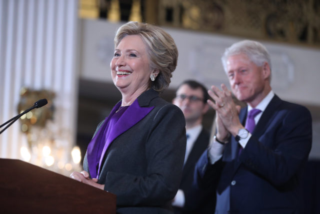 Former President Bill Clinton applauds as his wife, Democratic presidential candidate Hillary Clinton speaks in New York, Nov. 9, 2016. Clinton conceded the presidency to Donald Trump in a phone call early Wednesday morning, a stunning end to a campaign that appeared poised right up until Election Day to make her the first woman elected U.S. president. (AP)