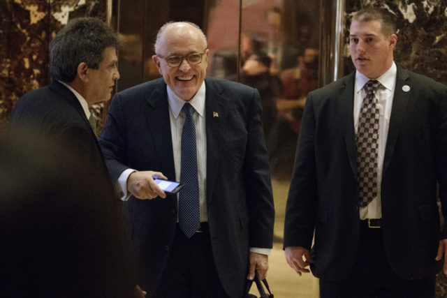 Former New York Mayor Rudy Giuliani, center, smiles as he leaves Trump Tower Nov. 11, 2016, in New York. Giuliani's name has been floated as a possibility for Secretary of State under Donald Trump. (AP)