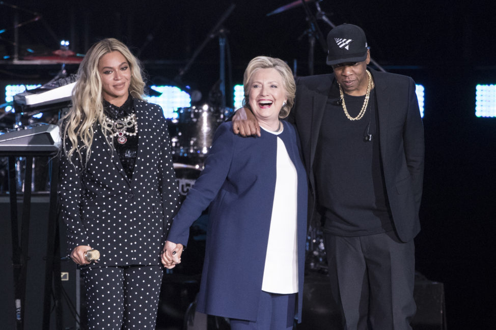 Jay Z, right, and Beyonce, left, stand with Democratic presidential candidate Hillary Clinton during a campaign rally in Cleveland, Nov. 4, 2016. (AP)