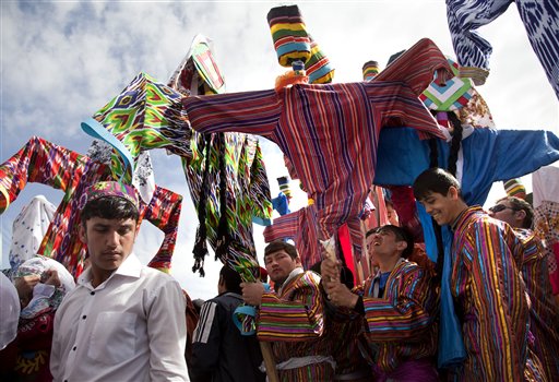 Puppet performers prepare to take to the stage at Navruz festivities in Dushanbe, Tajikistan, Monday, March 21, 2011. Navruz is a spring festival celebrated around equinox in Iran, Central Asia and the Caucasus. Banned in the Communist era, the festival enjoys a revival in ex-Soviet states.(AP Photo/Theodore Kaye)